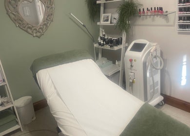 Serenity Beauty therapy room with bed and equipment in Bury St Edmunds, GB.