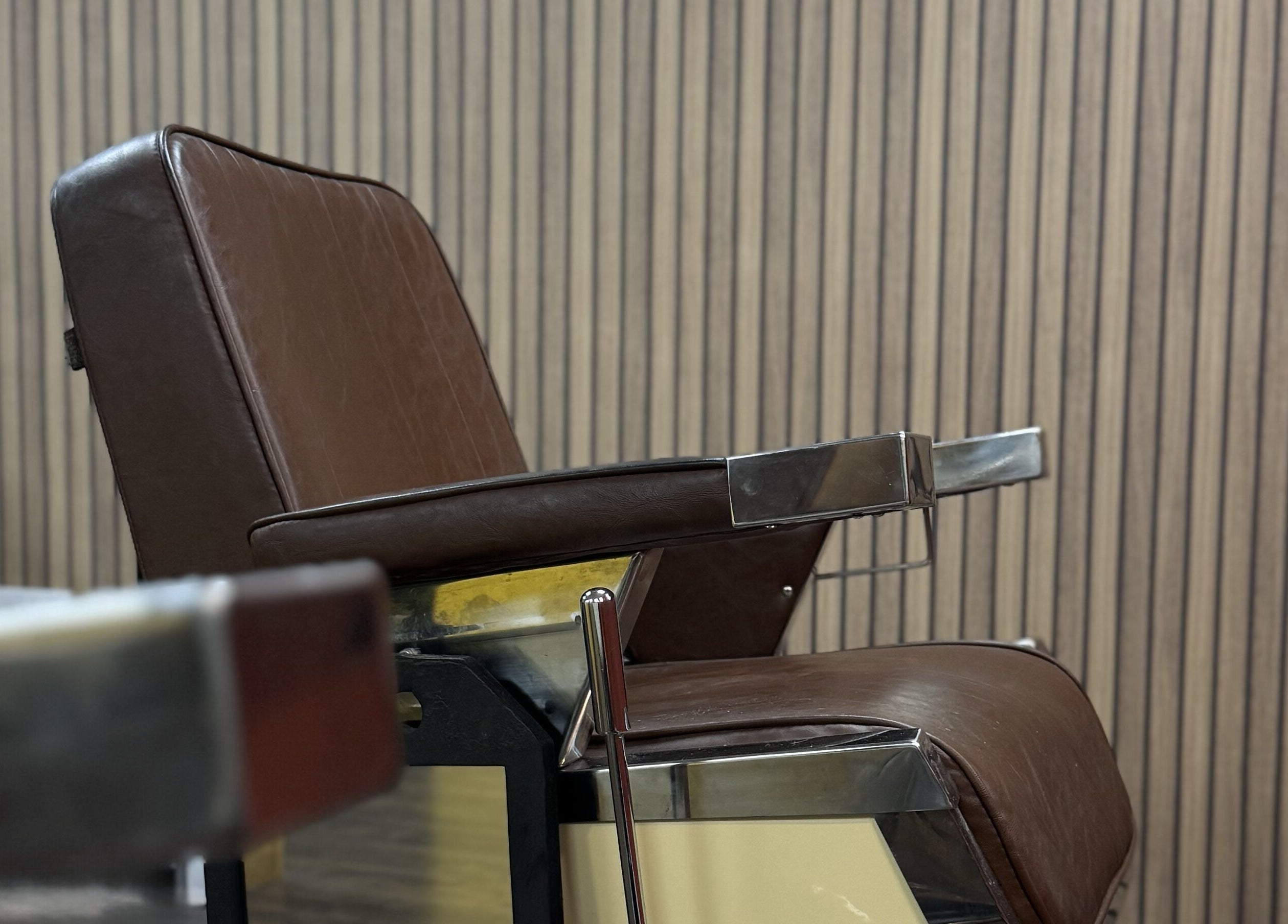 Elegant barber chair at Wild's Barbershop in Sheffield, England, GB, showcasing classic style.