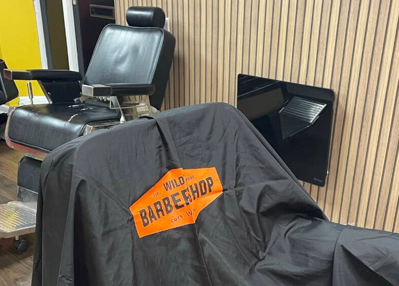 Barber chair at Wild's Barbershop in Sheffield, England, GB, showcasing sleek design and comfort.