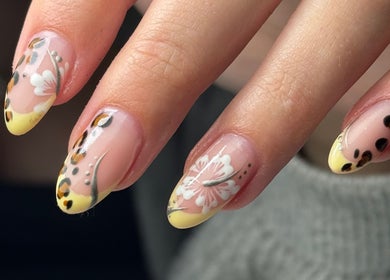 Elegant floral nail art by Georgina.NailArtist at Keighey, England, GB. Yellow and black accents enrich the design.