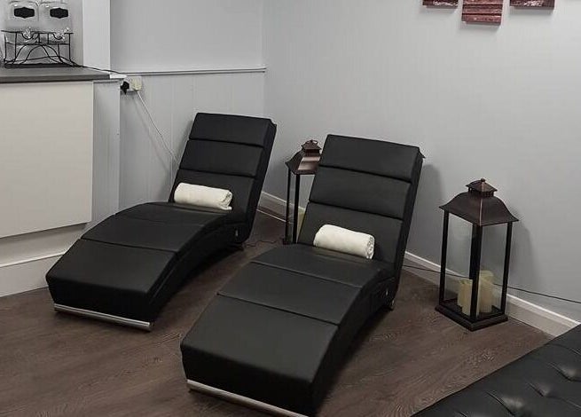 Comfortable lounge chairs at LA Beauty and Spa, Aston, England, GB, offering a serene relaxation area.