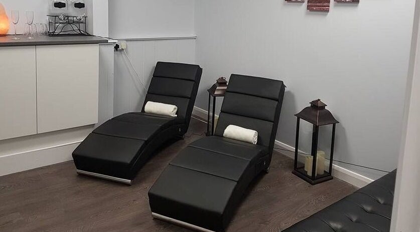 Comfortable lounge chairs at LA Beauty and Spa, Aston, England, GB, offering a serene relaxation area.