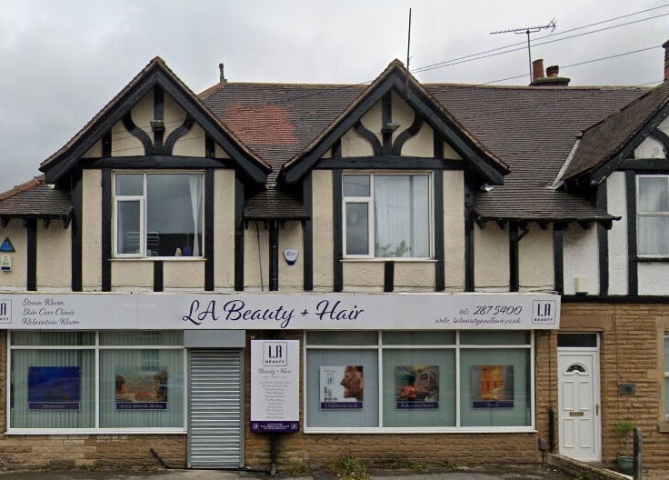 Front view of LA Beauty and Spa in Aston, England, GB, featuring a traditional building with elegant signage.