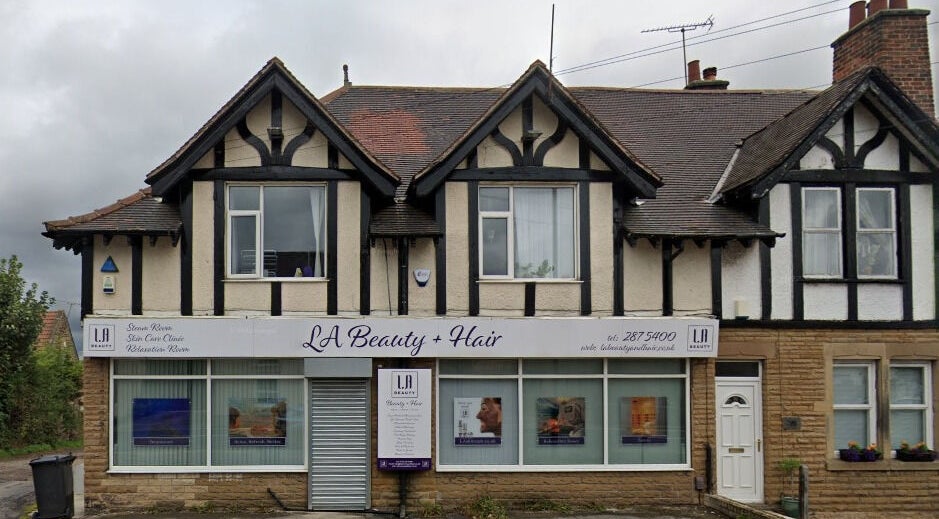 Front view of LA Beauty and Spa in Aston, England, GB, featuring a traditional building with elegant signage.