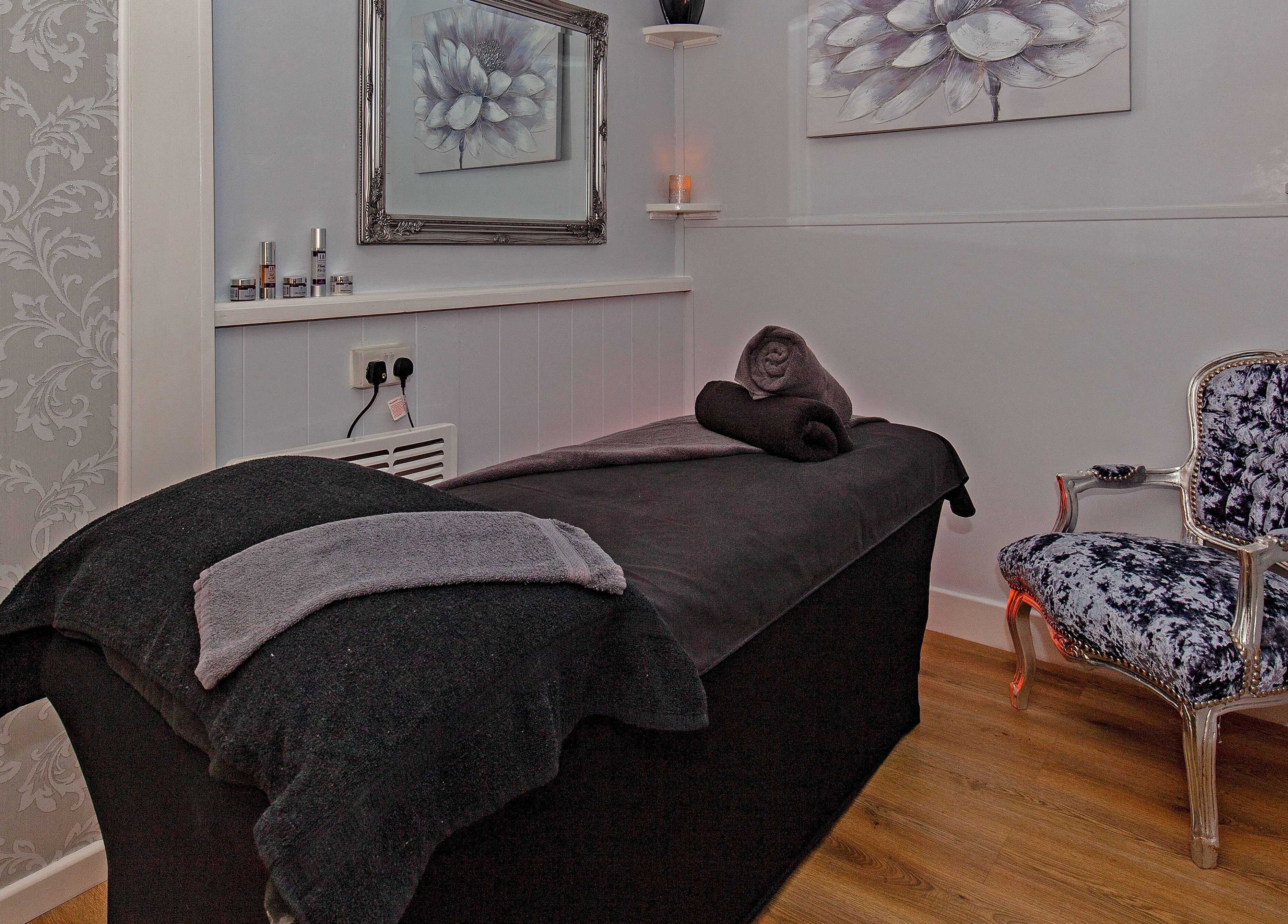 Luxurious treatment room at LA Beauty and Spa in Aston, England, GB with plush decor and ambient lighting.