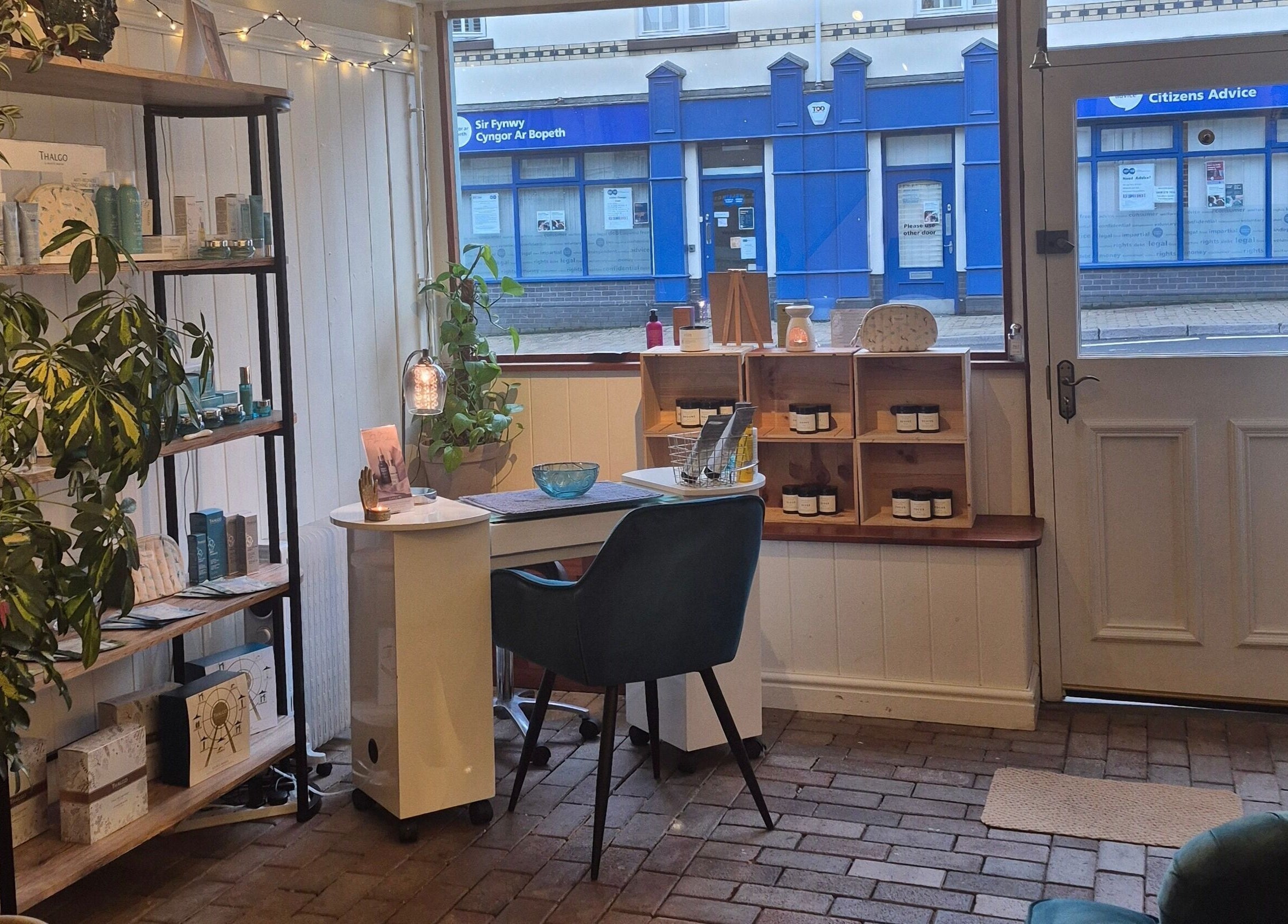 Inviting interior of Room 2 at Abergavenny, Wales, GB with elegant furnishings and wellness products.