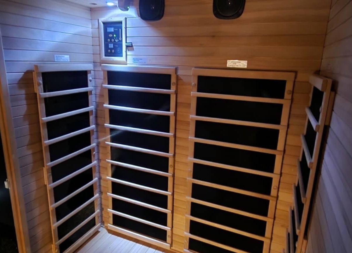 Relaxing sauna area at Classic Cuts Salon in Cresson, Pennsylvania, US showcasing a tranquil wooden design.