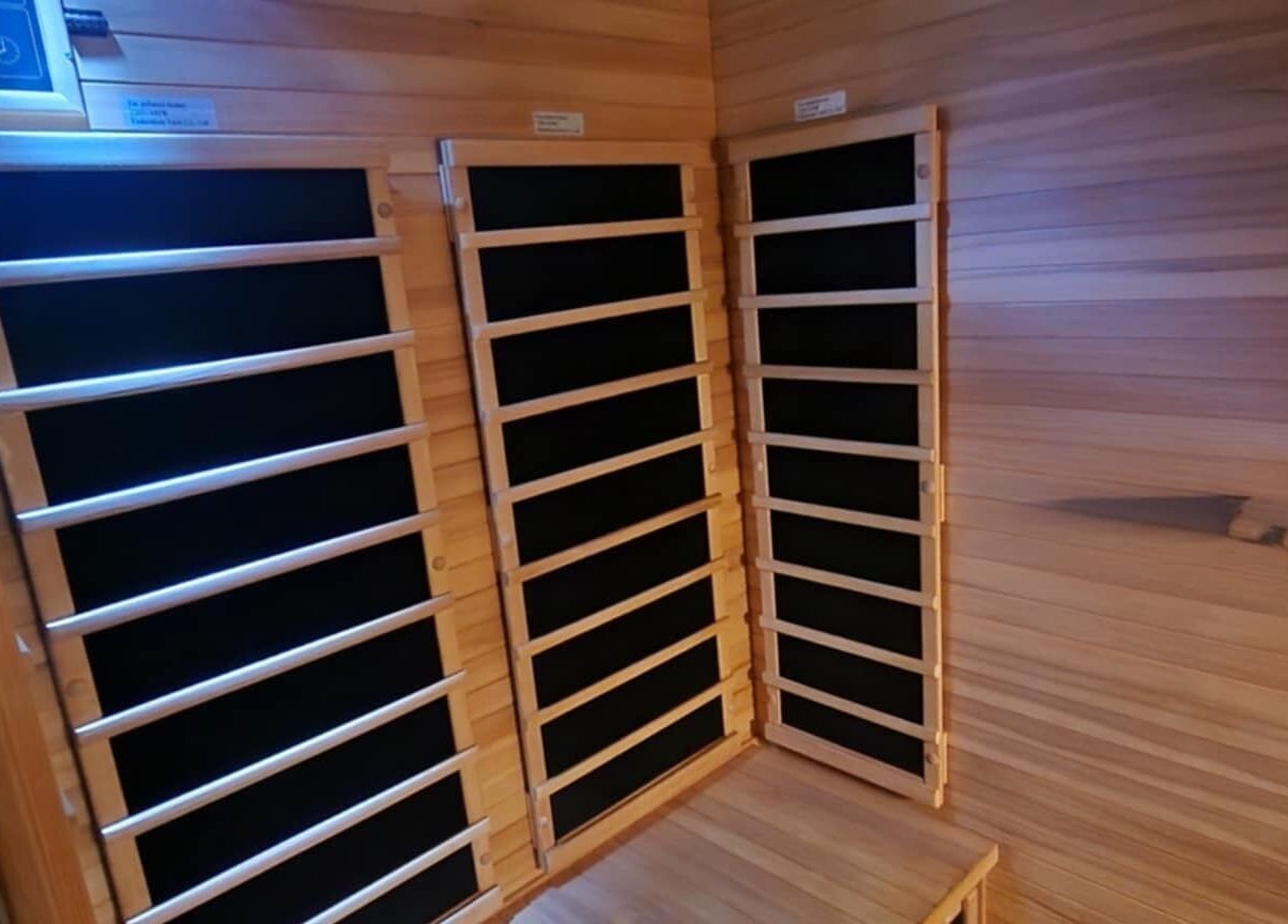 Interior of infrared sauna at Classic Cuts Salon in Cresson, Pennsylvania, US, offering a relaxing wellness experience.