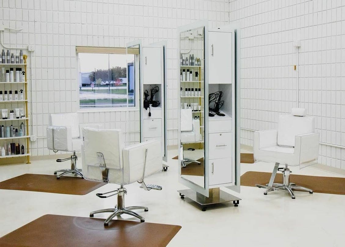 Modern styling chairs at Remedy Salon in Appleton, Wisconsin, US with bright, sleek decor.