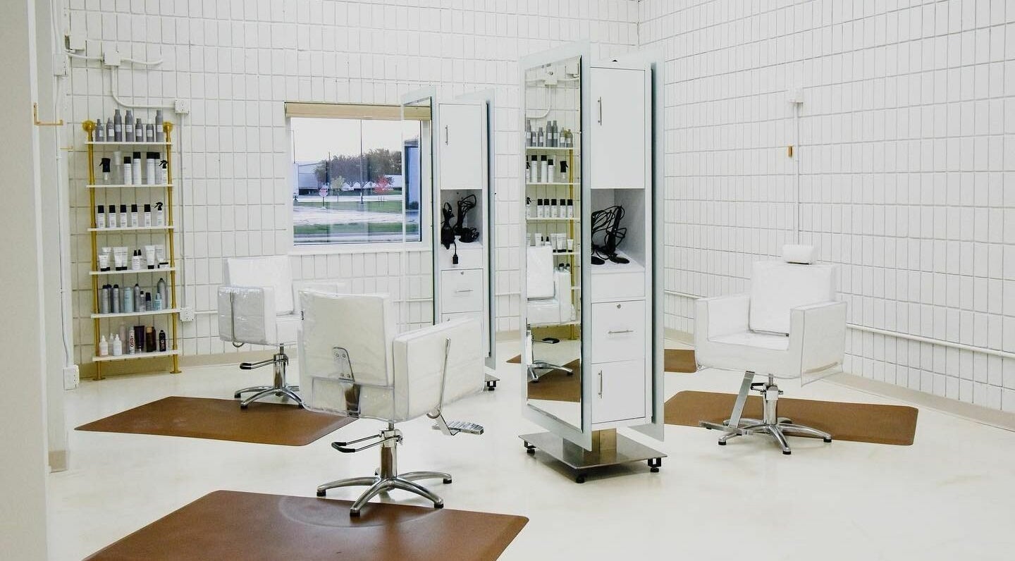 Modern styling chairs at Remedy Salon in Appleton, Wisconsin, US with bright, sleek decor.