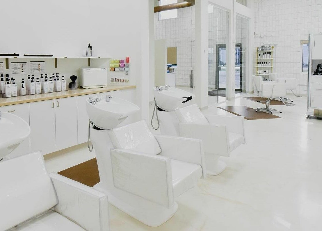 Modern hair wash stations and styling chairs at Remedy Salon in Appleton, Wisconsin, US.