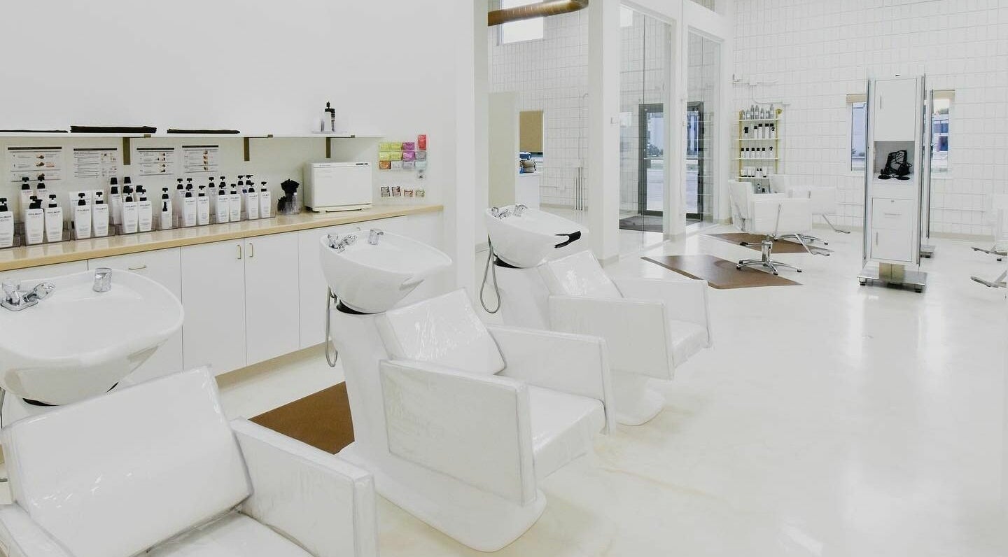 Modern hair wash stations and styling chairs at Remedy Salon in Appleton, Wisconsin, US.