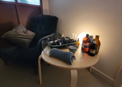 Relaxing corner at AmberLuna Apothecary in Bristol, England. Cozy chair and essential oils create a tranquil ambiance.