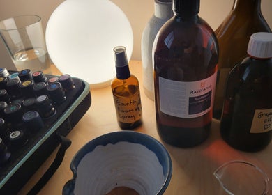 AmberLuna Apothecary's aromatherapy oils and sprays in Bristol, England, GB displayed on a wooden table.