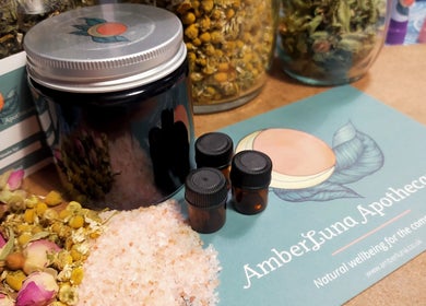 Handcrafted wellness products at AmberLuna Apothecary, Bristol, England, GB, featuring salts and oils.
