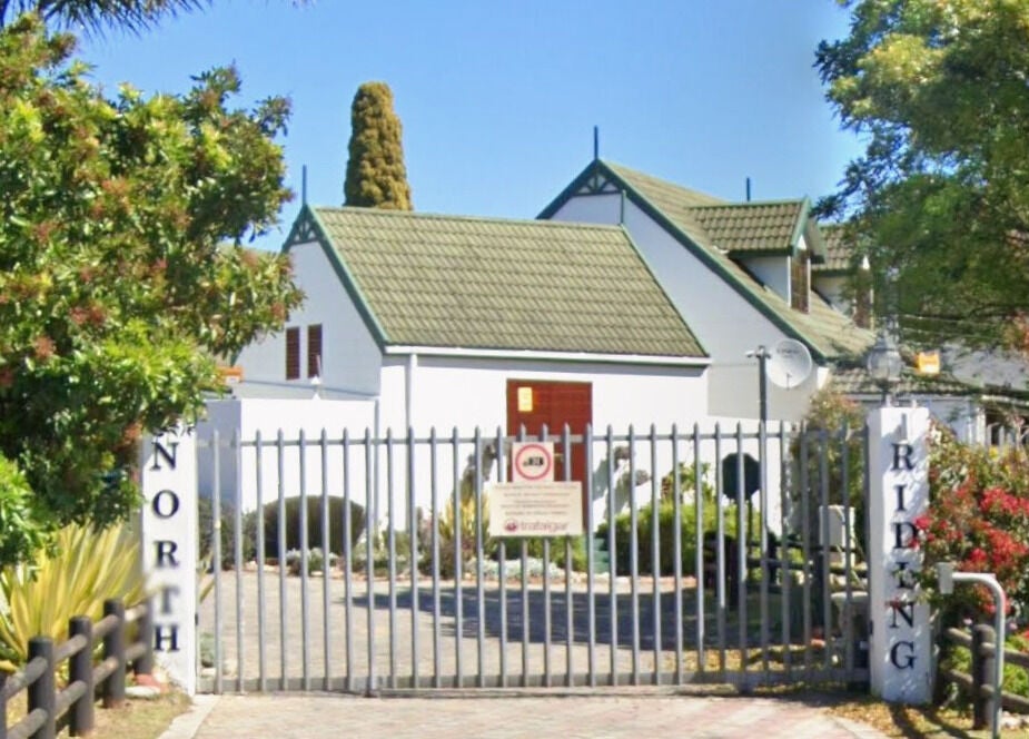 Entrance of Perfectly Splendid By Lucinda Hill, a serene venue in Gqeberha, Eastern Cape, ZA surrounded by lush greenery.