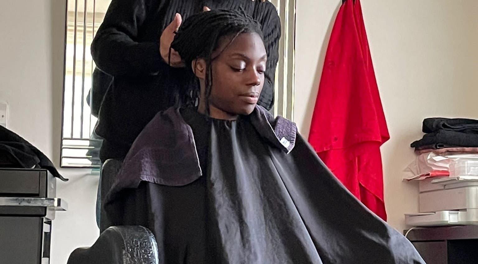 Client receiving hair care at Natural Touch hair studio, Enfield, Middlesex, GB.