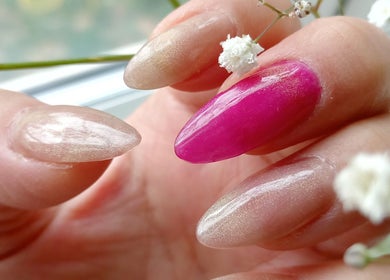 Stylish manicure featuring glossy pink and beige nails at Abundance of Beauty, Birmingham, England, GB.