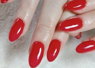 Vibrant red nails at Abundance of Beauty, Birmingham, England, GB, showcasing expert manicure services.