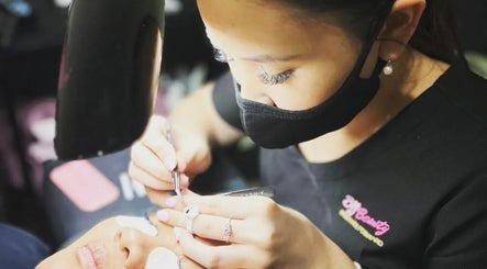 Technician applying eyelash extensions at Best Face Forward Beauty in Maryborough, Queensland, AU.