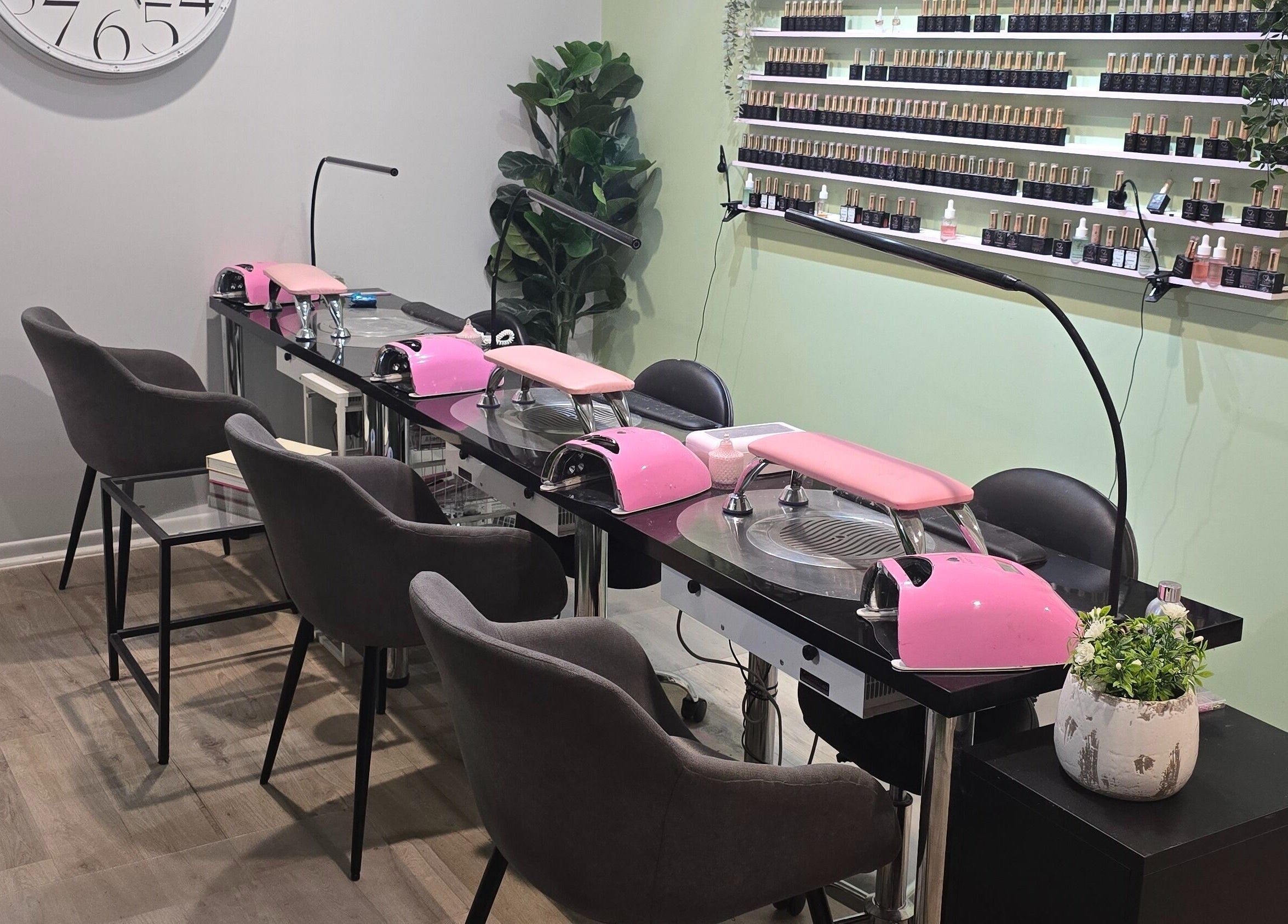 Modern nail salon setup at Best Face Forward Beauty in Maryborough, Queensland, AU featuring pink decor.