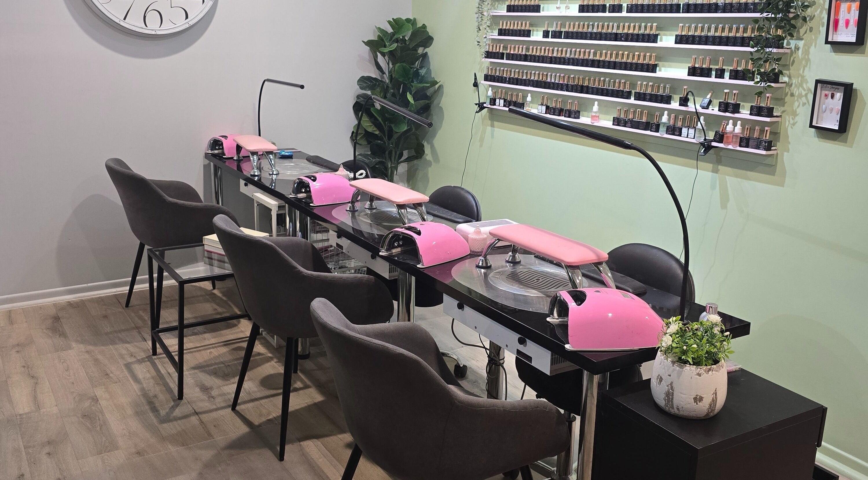 Modern nail salon setup at Best Face Forward Beauty in Maryborough, Queensland, AU featuring pink decor.
