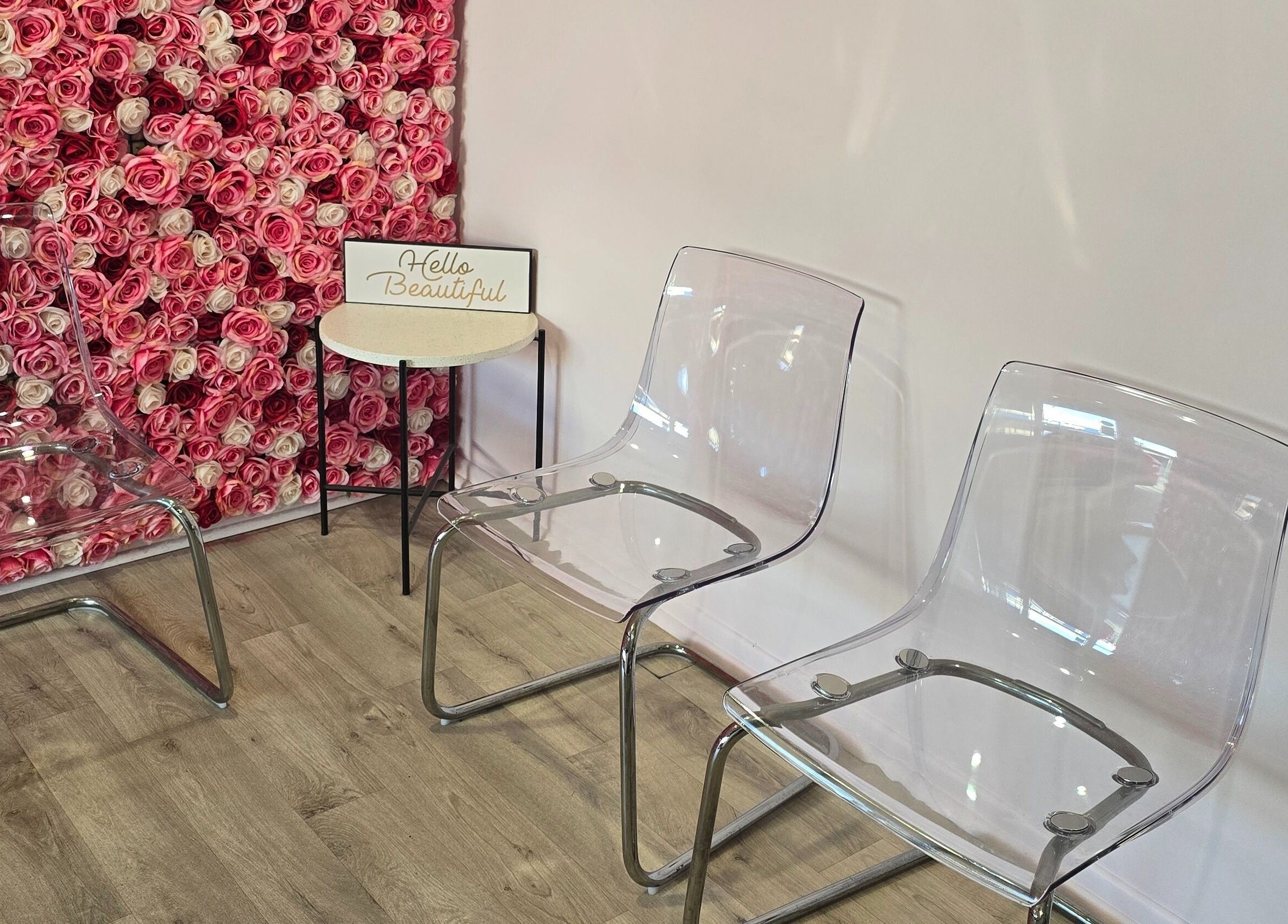 Elegant seating with rose wall at Best Face Forward Beauty in Maryborough, Queensland, AU.