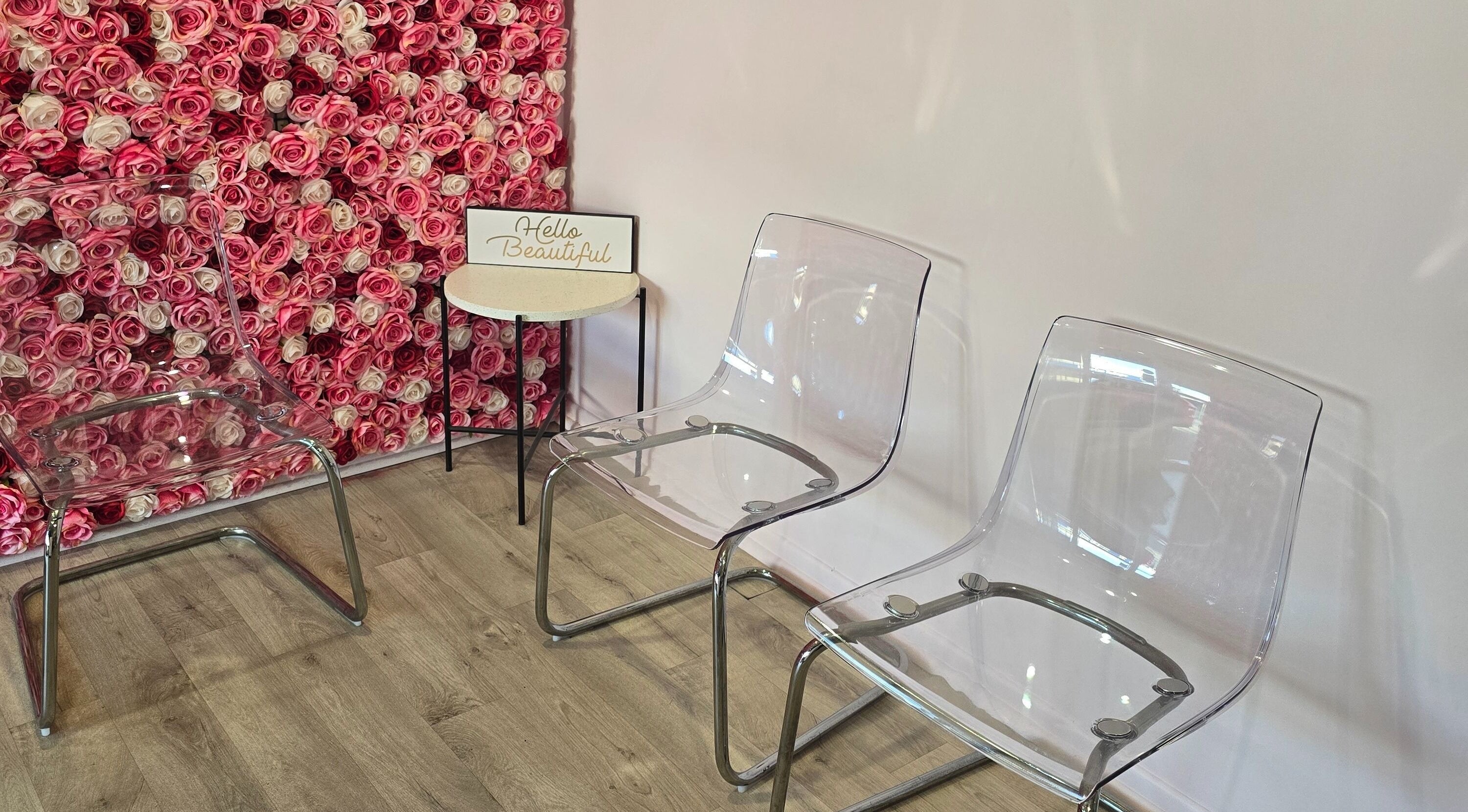 Elegant seating with rose wall at Best Face Forward Beauty in Maryborough, Queensland, AU.