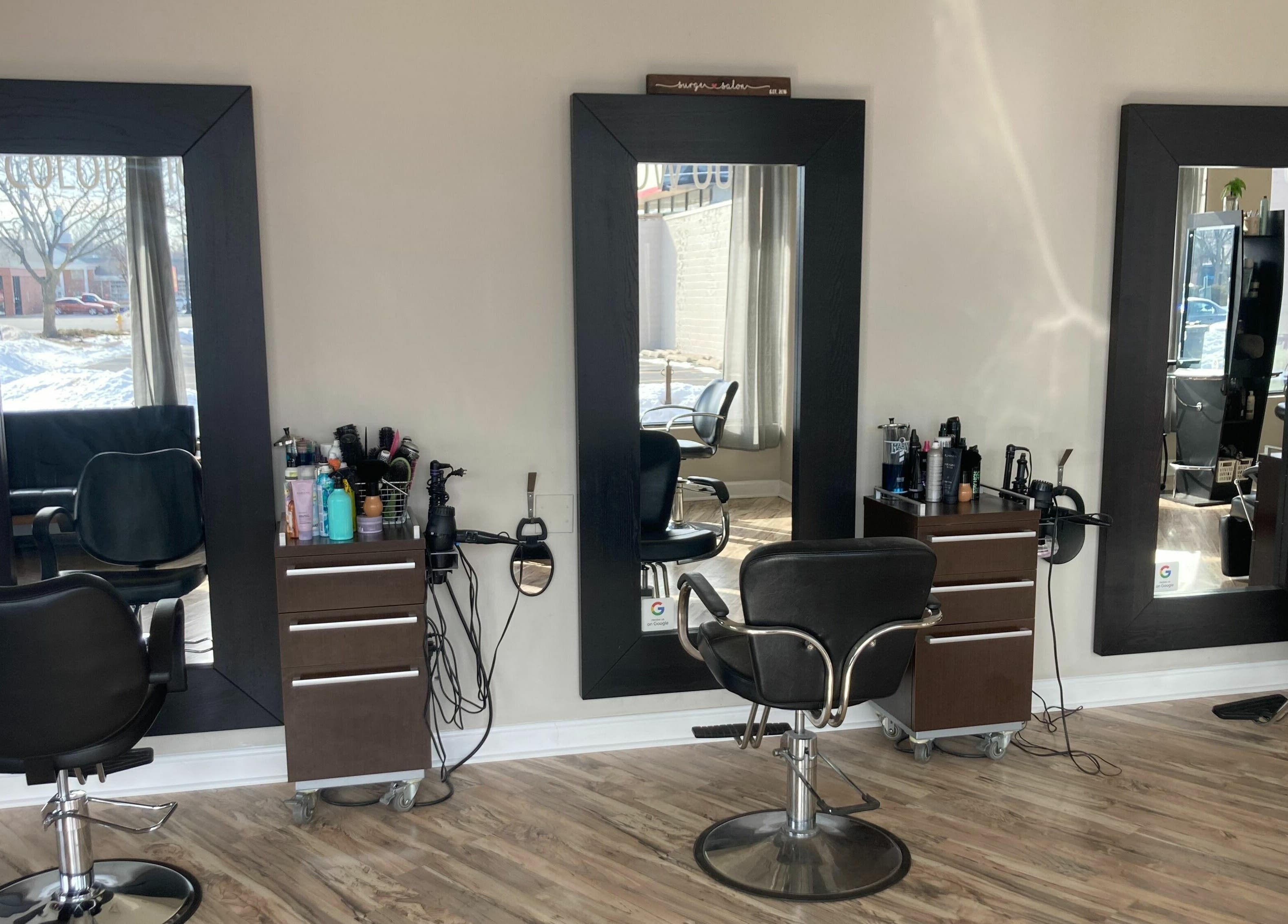 Elegant styling stations at Surge Salon, Glen Ellyn, Illinois, US, showcasing modern salon elegance.