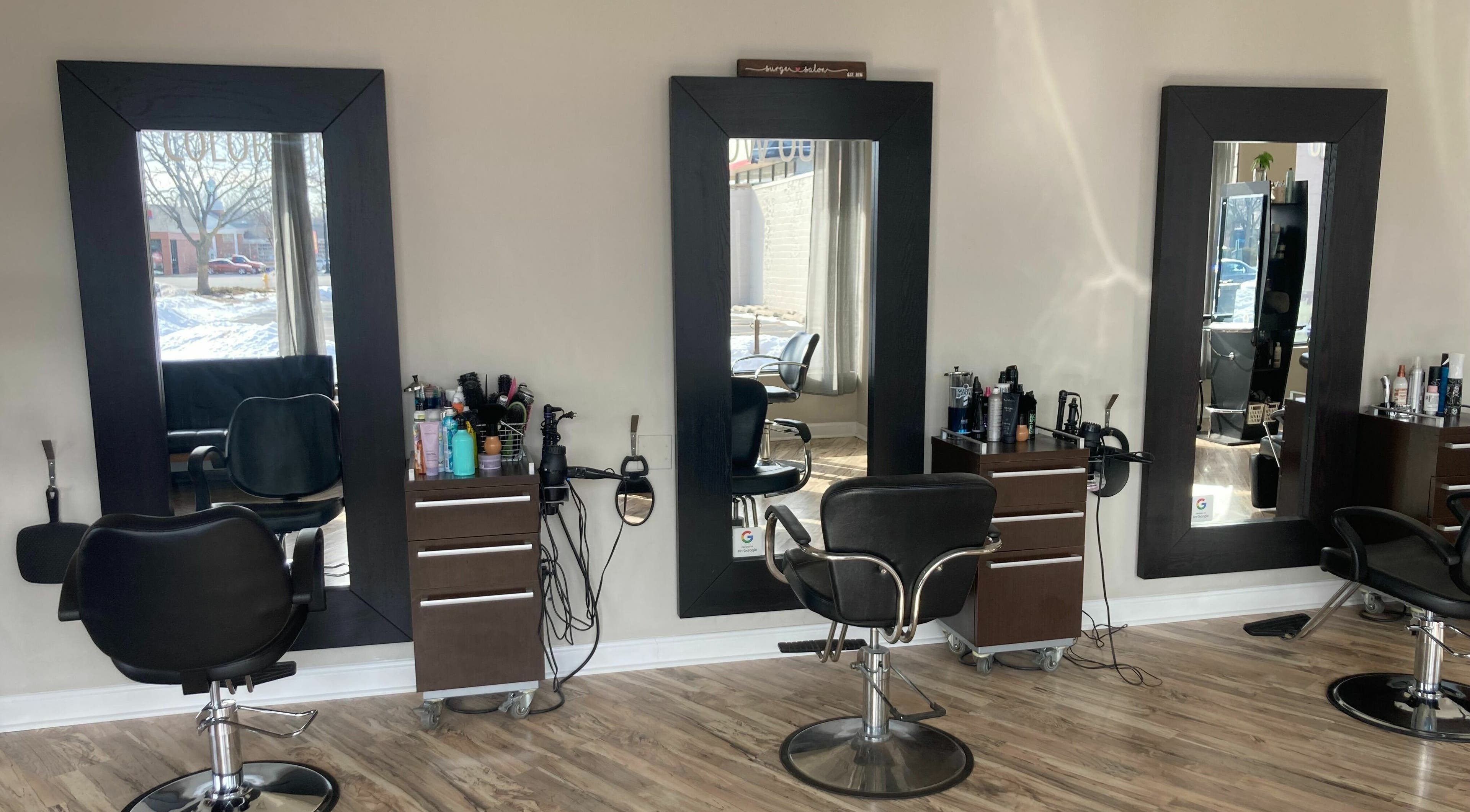 Elegant styling stations at Surge Salon, Glen Ellyn, Illinois, US, showcasing modern salon elegance.