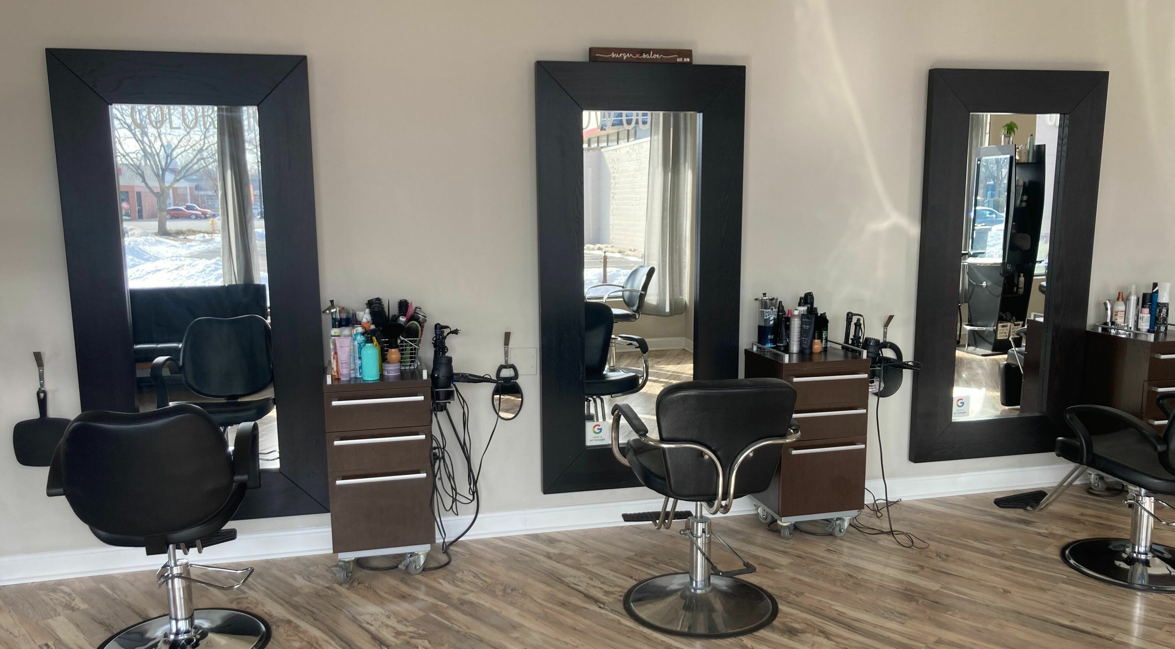 Elegant styling stations at Surge Salon, Glen Ellyn, Illinois, US, showcasing modern salon elegance.