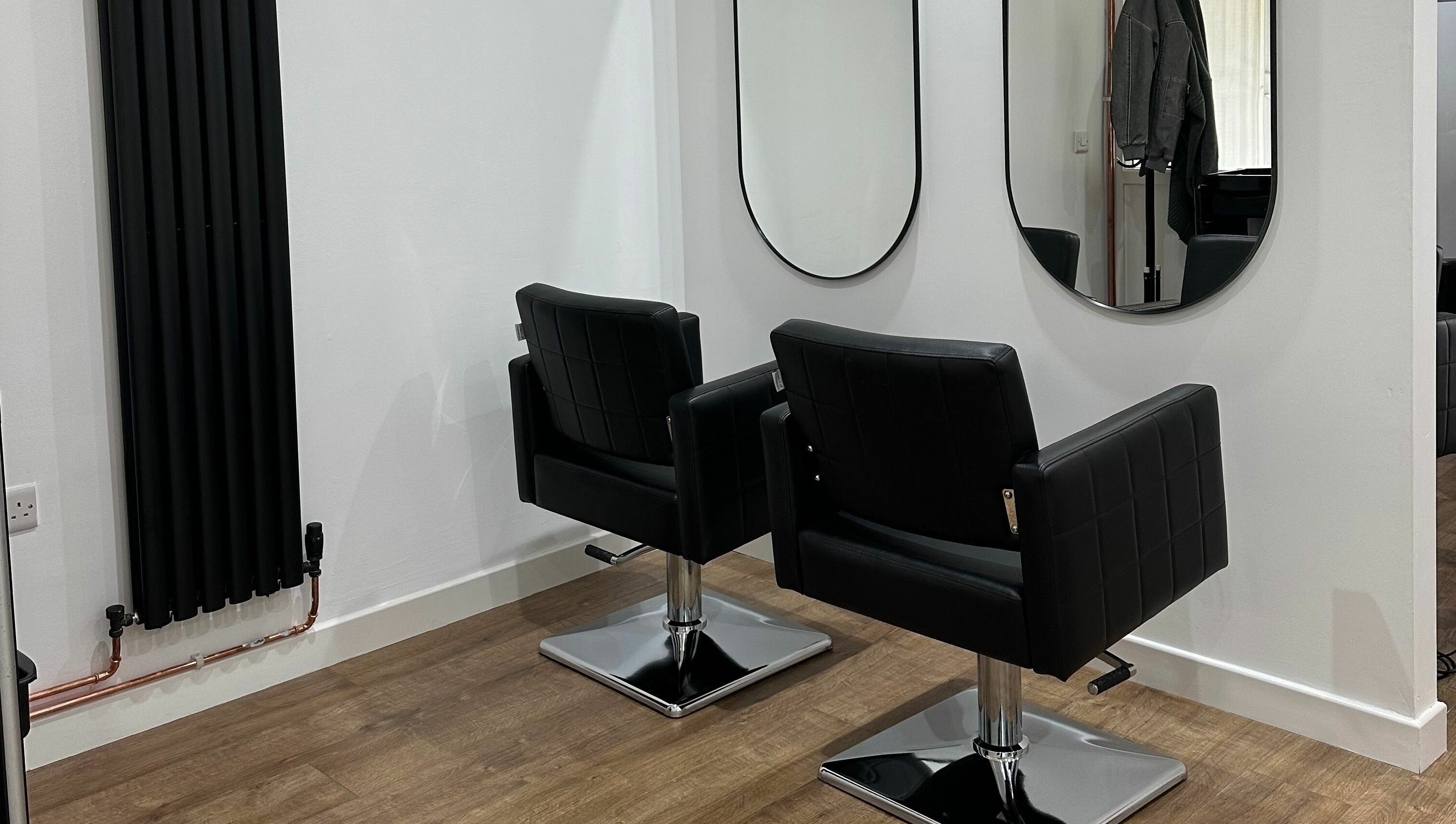 Modern chairs and mirrors at Nickies Salon & Academy, Musselburgh, Scotland, GB.