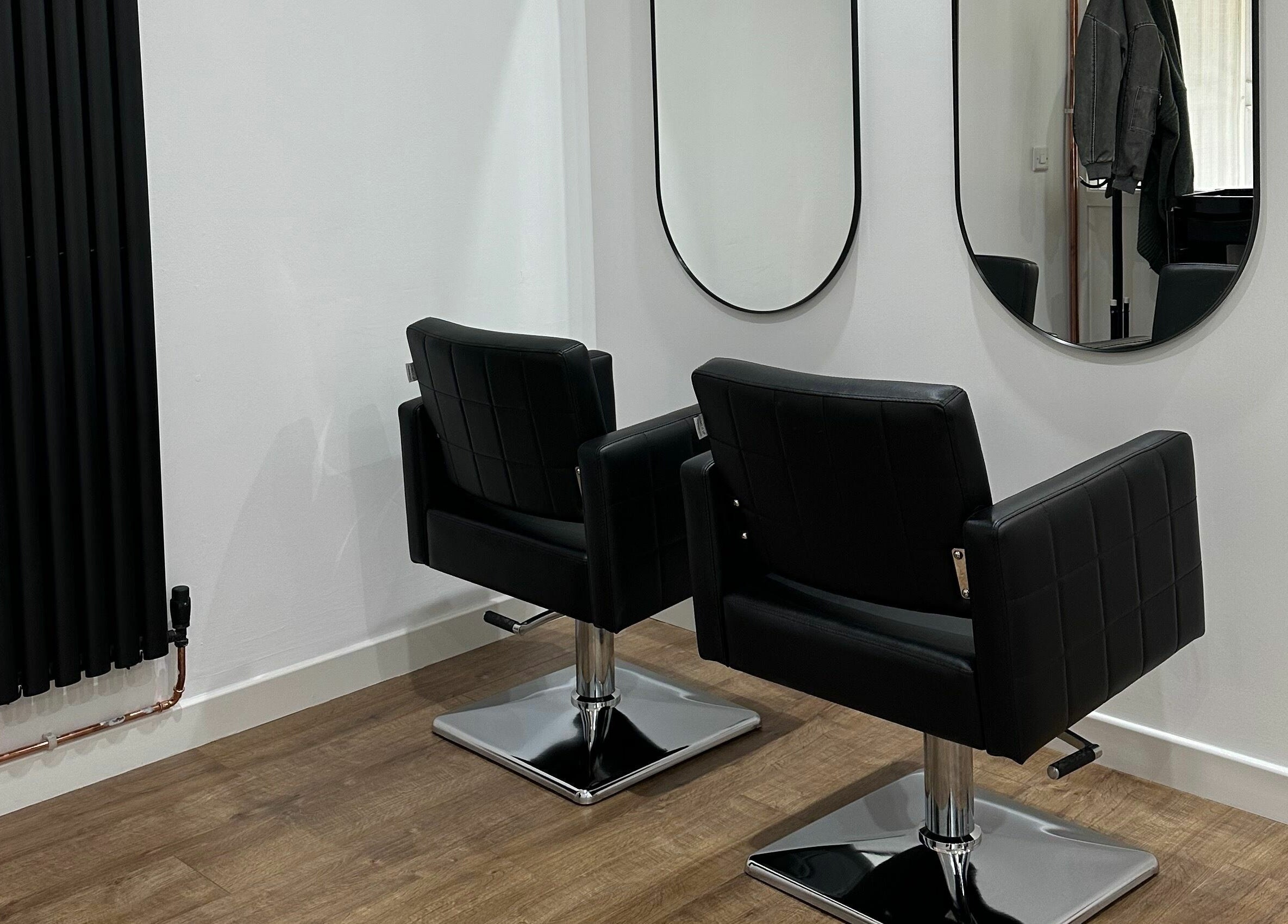 Modern chairs and mirrors at Nickies Salon & Academy, Musselburgh, Scotland, GB.