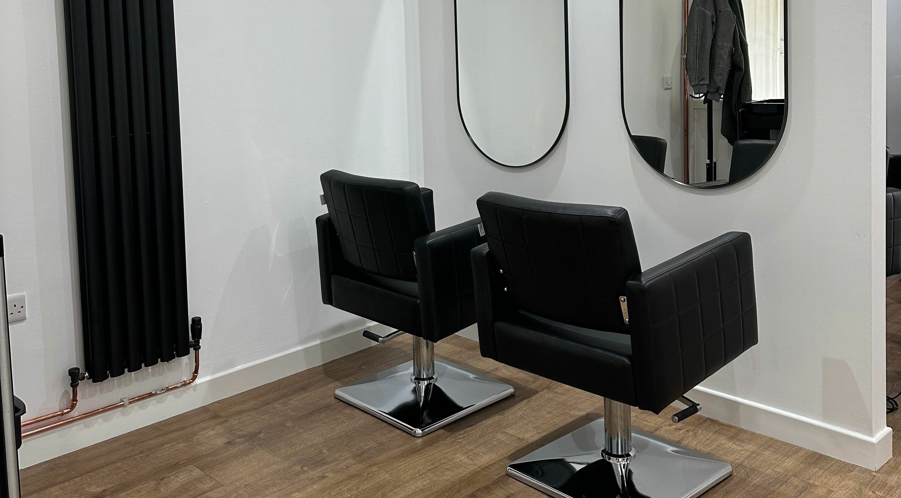 Modern chairs and mirrors at Nickies Salon & Academy, Musselburgh, Scotland, GB.