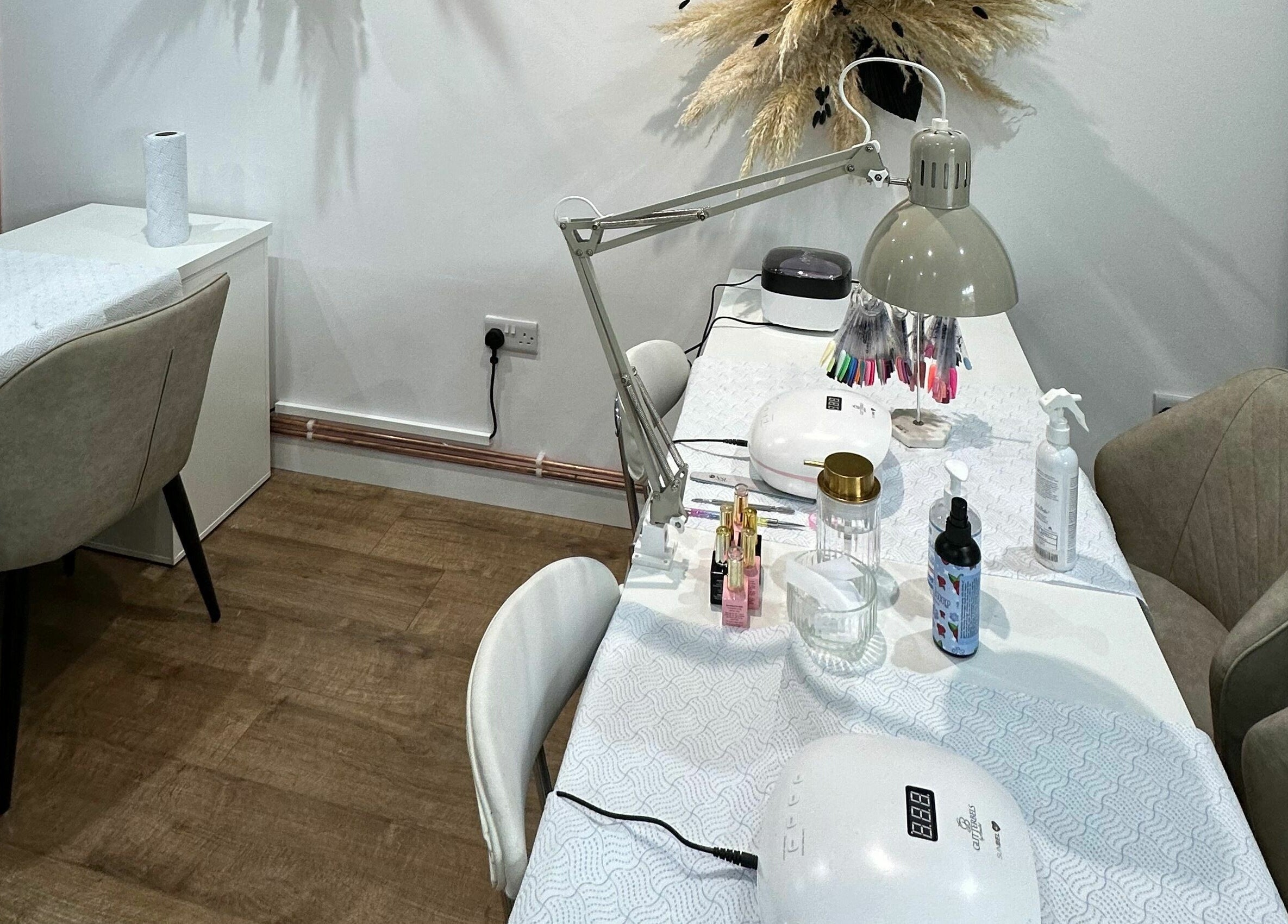 Elegant nail station at Nickies Salon & Academy, Musselburgh, Scotland, GB, featuring modern decor and tools.