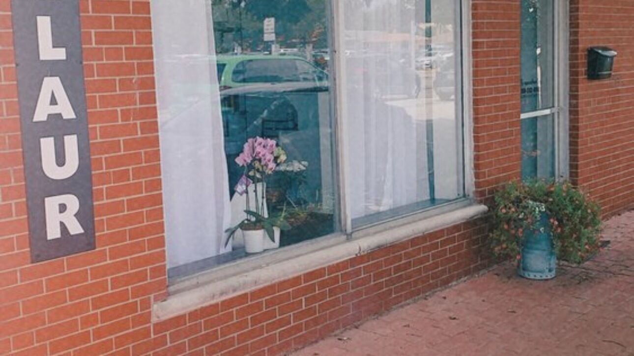 Allaur by Alyssa's inviting exterior in Evergreen Park, Illinois, US with blooming flowers by the window.