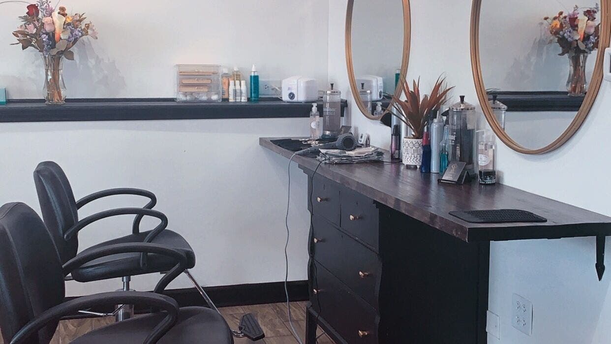 Chic salon interior at Allaur-Lauren Alyssa, Evergreen Park, Illinois, US, with stylish chairs and mirrors.