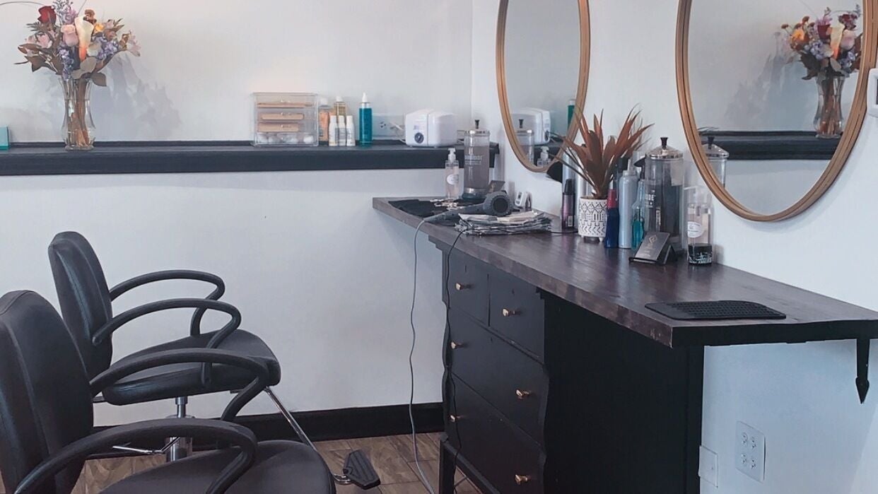 Chic salon interior at Allaur-Lauren Alyssa, Evergreen Park, Illinois, US, with stylish chairs and mirrors.