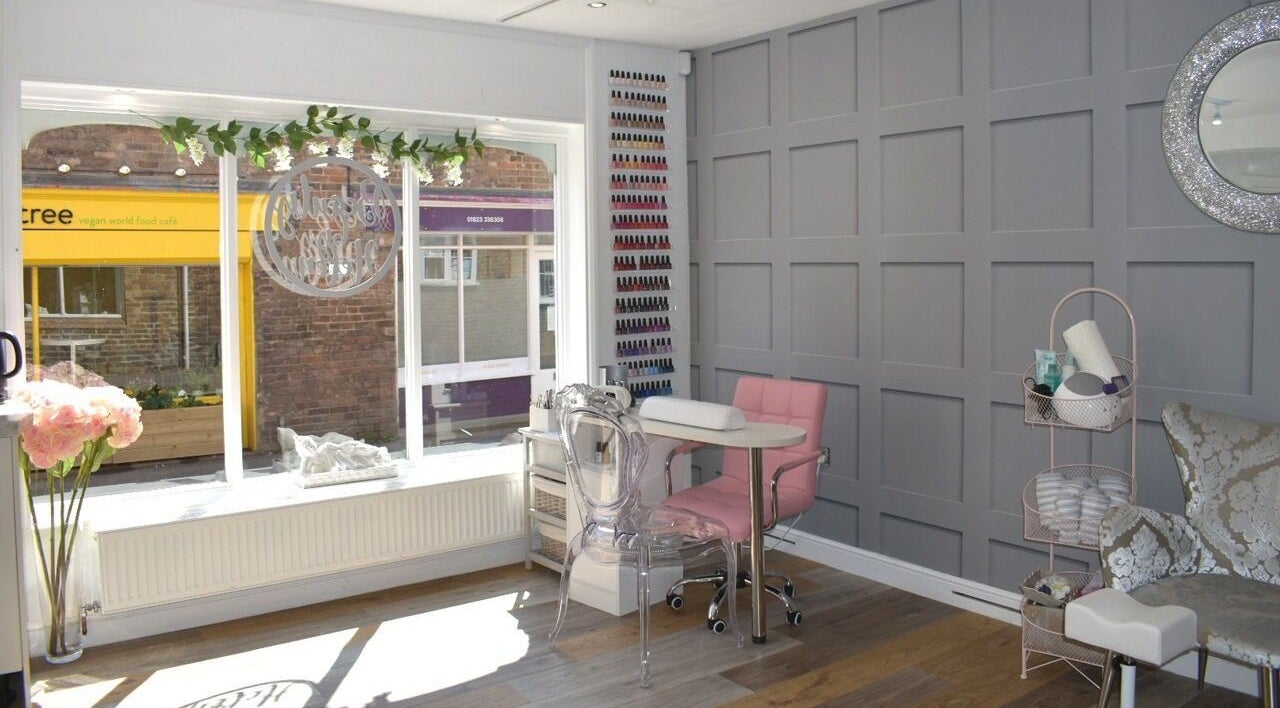 Chic interior of Beauty By Helen, Taunton, England, GB, with elegant nail polish display and relaxing decor.