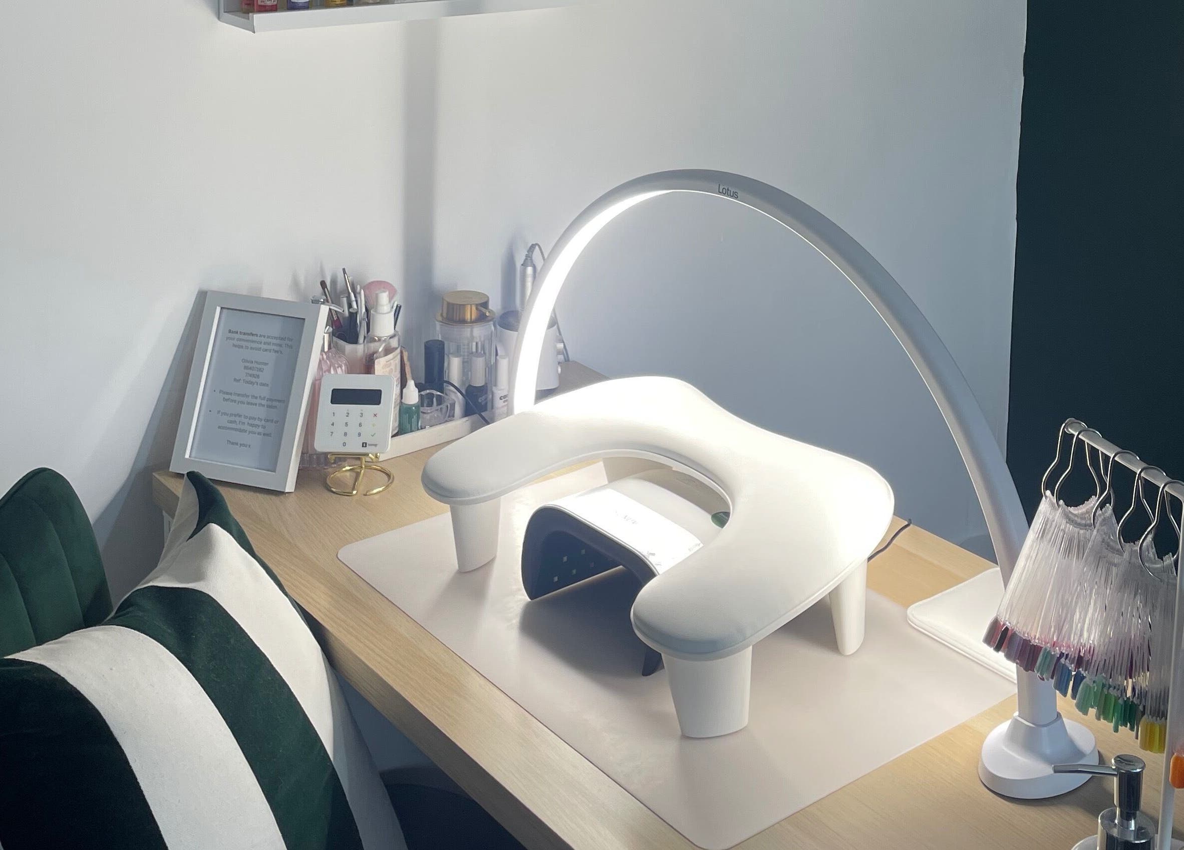 Elegant nail station at Beautology Newcastle, Whitley Bay, England, GB featuring manicure tools and cushions.