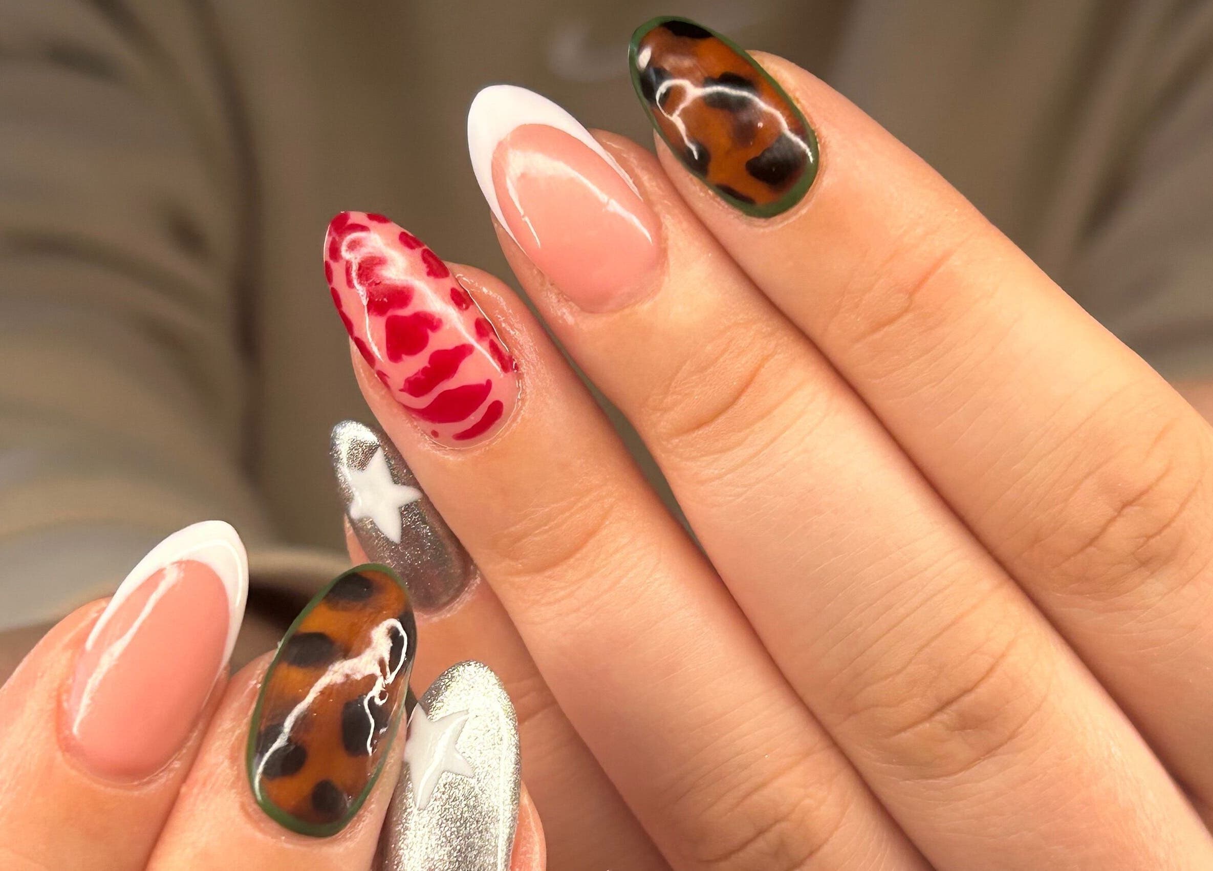 Colorful nail art at Beautology Newcastle in Whitley Bay, England, GB showcases modern design and style.