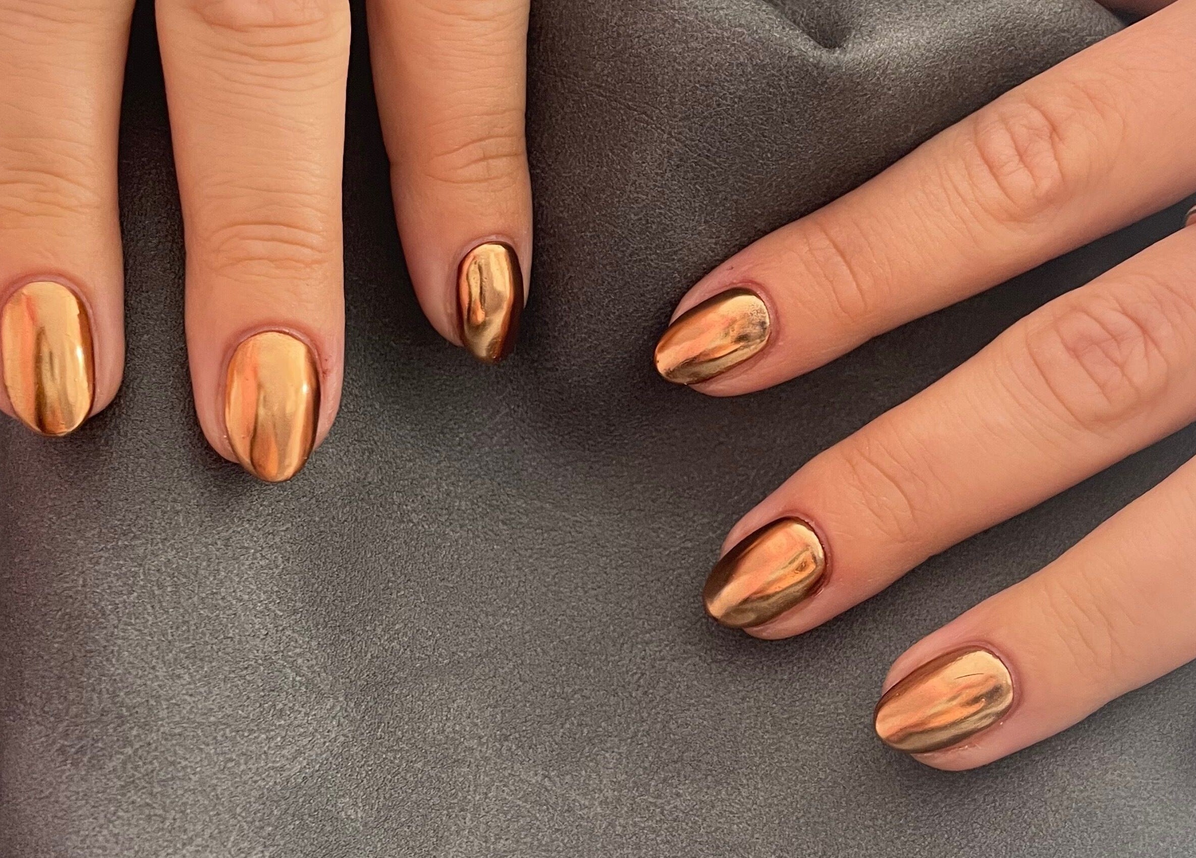 Elegant golden metallic nails at Beautology Newcastle, Whitley Bay, England, GB, showcasing expert manicure.