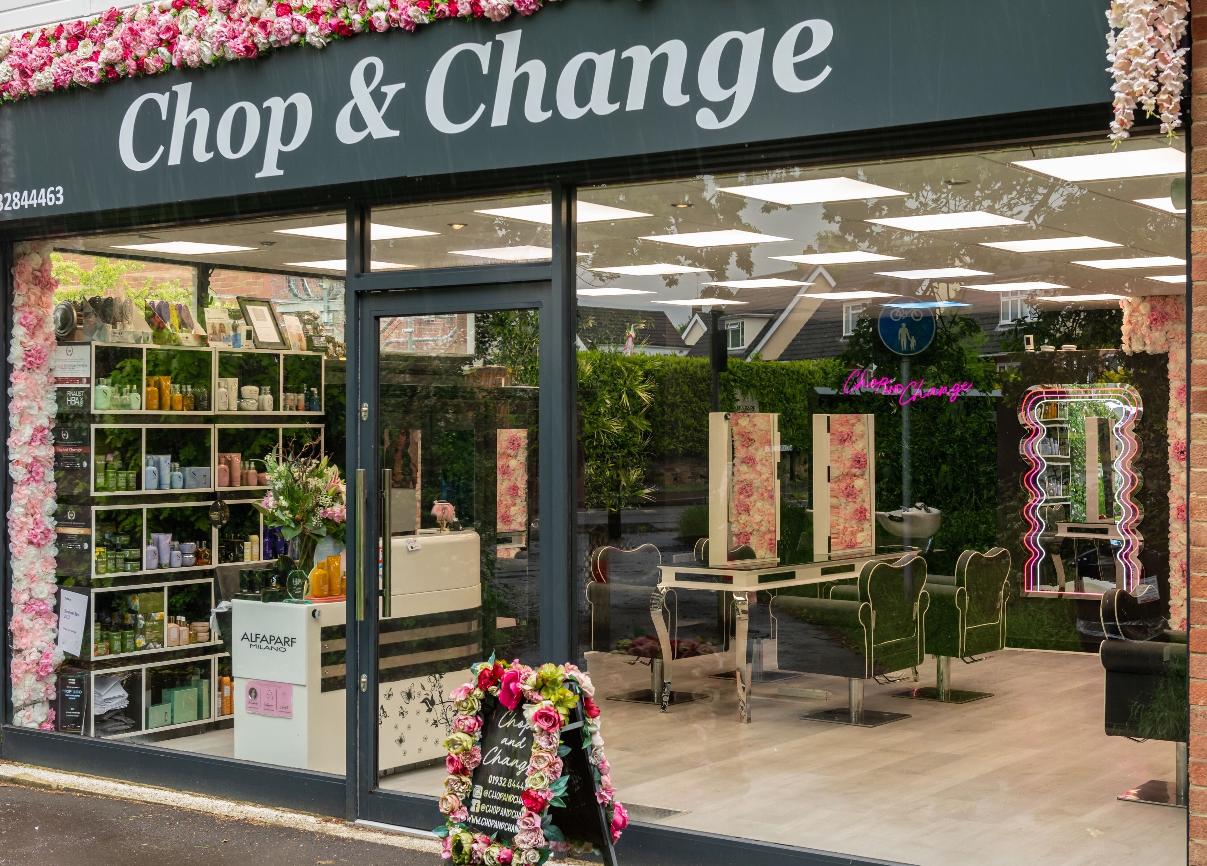 Exterior of Chop and Change beauty salon in Addlestone, England, GB with floral decor.