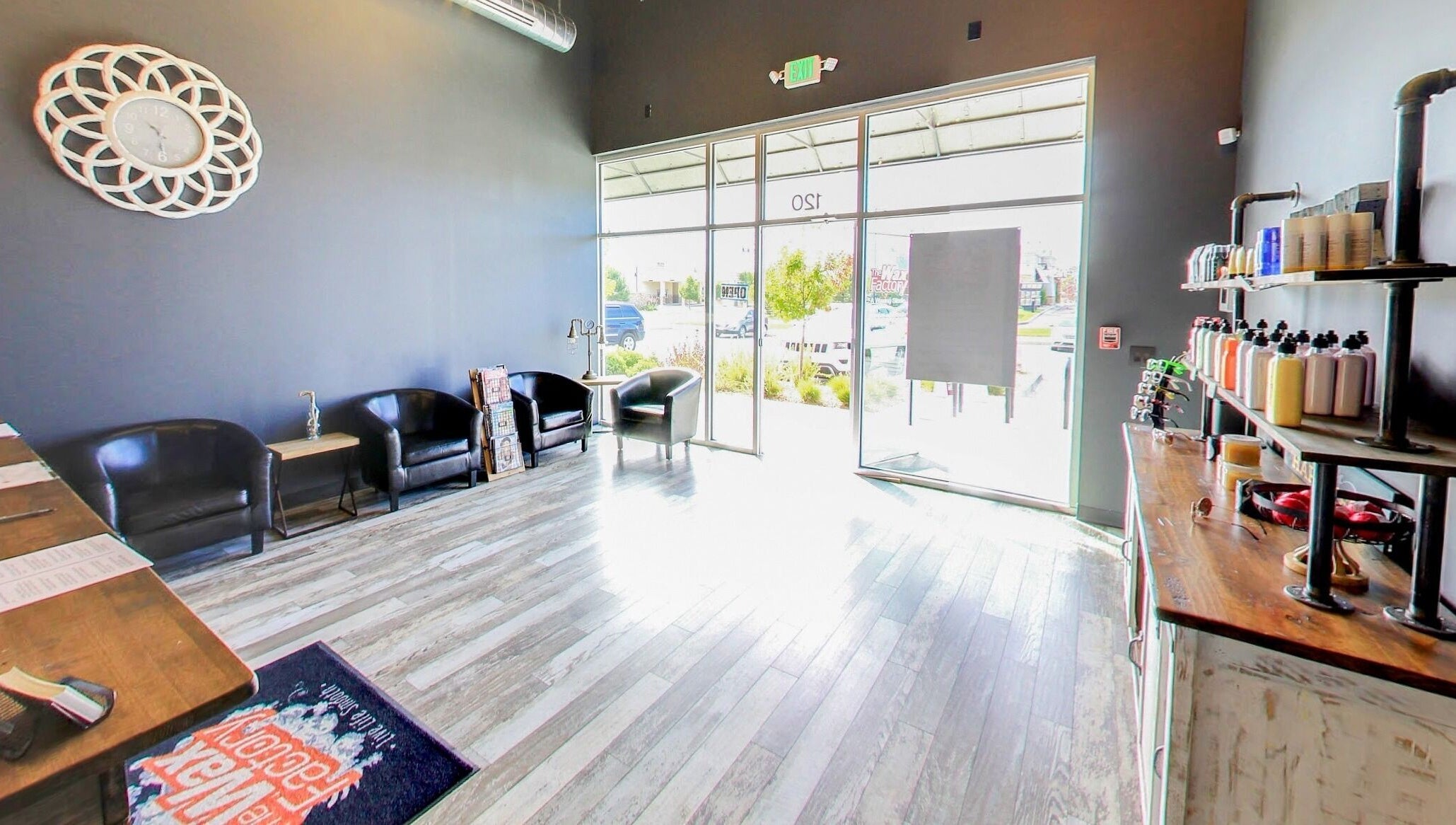 Bright, modern waiting area at The Wax Factory Longmont, Longmont, Colorado, US with sleek decor.