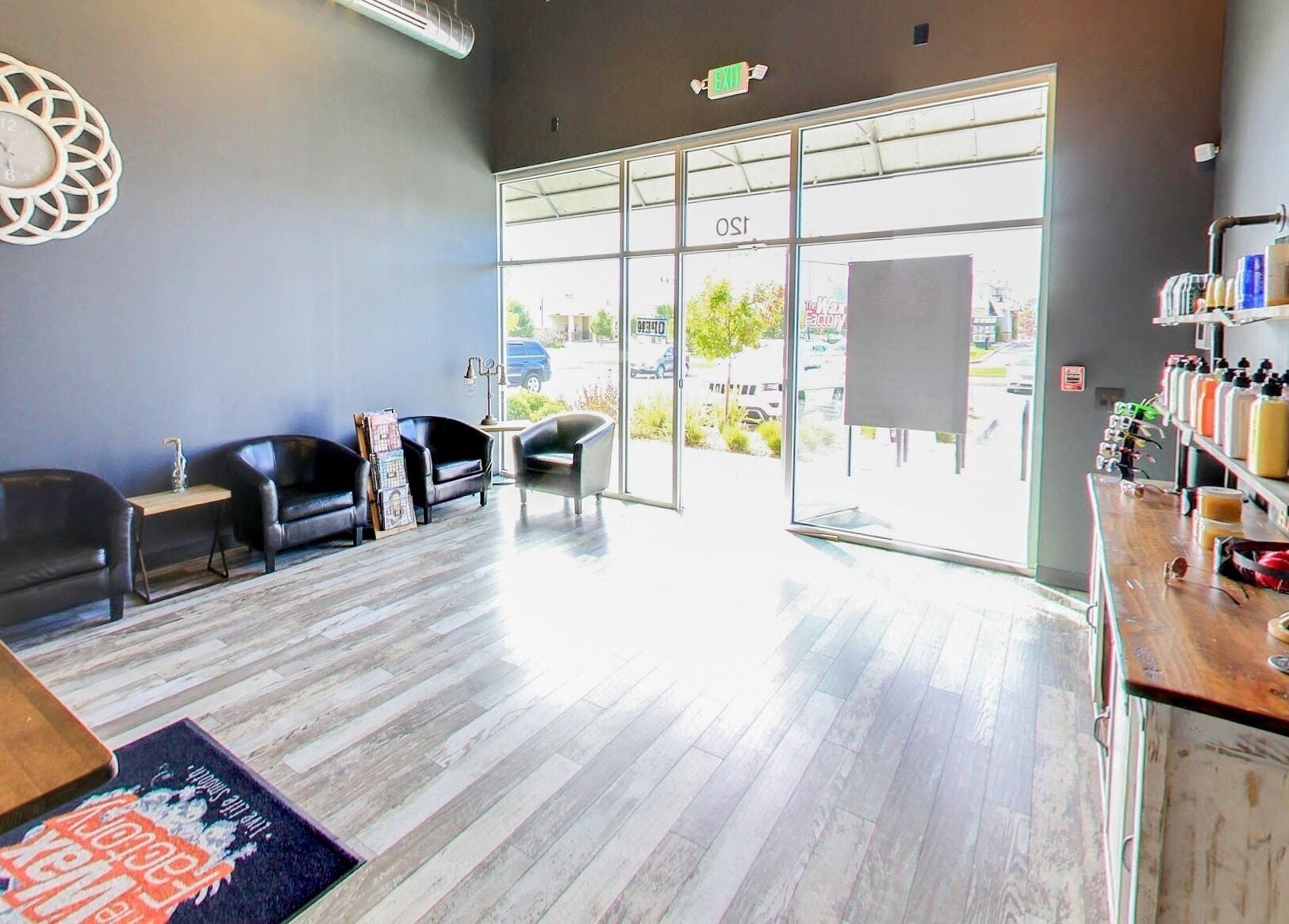Bright, modern waiting area at The Wax Factory Longmont, Longmont, Colorado, US with sleek decor.