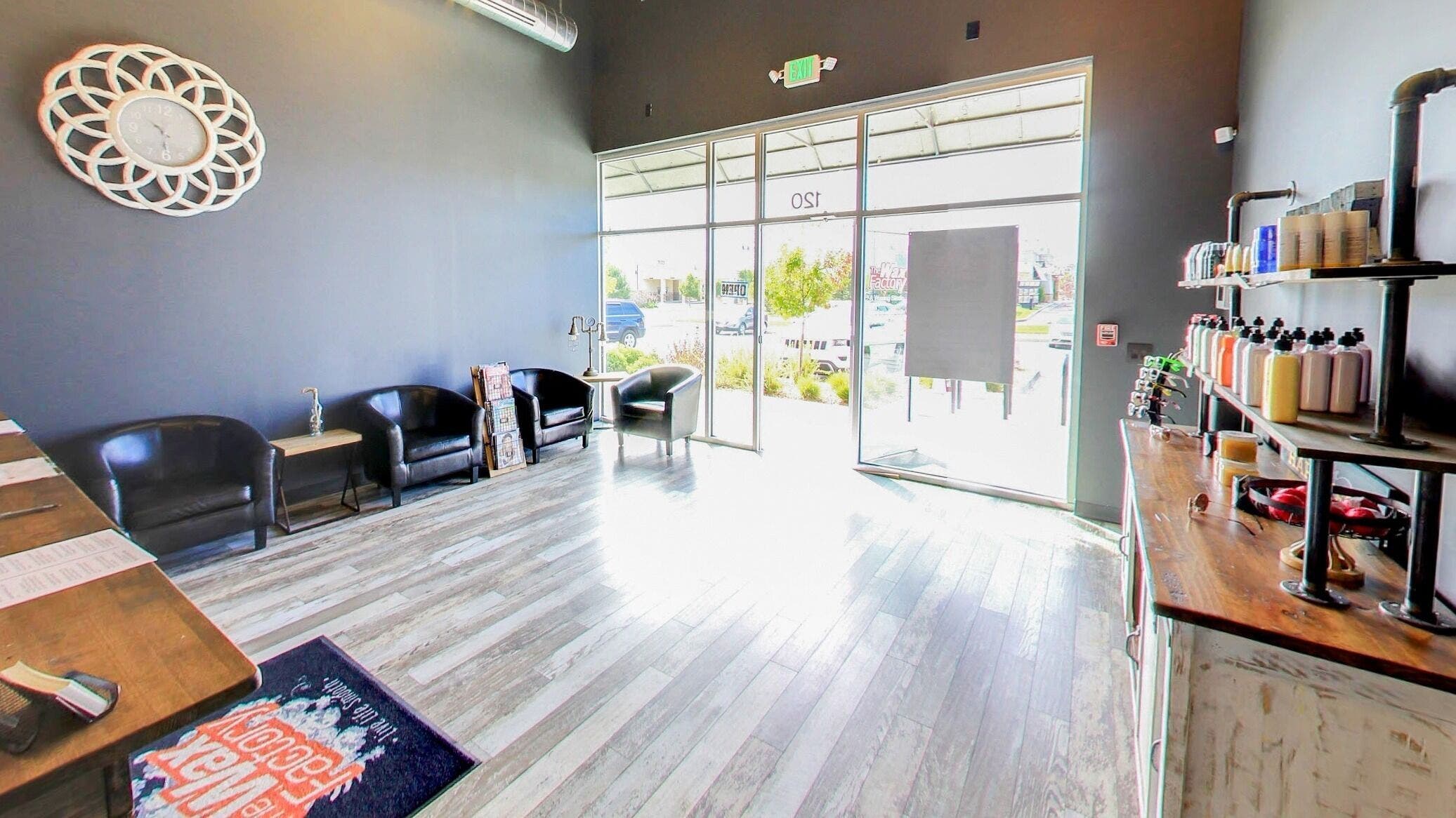 Bright, modern waiting area at The Wax Factory Longmont, Longmont, Colorado, US with sleek decor.