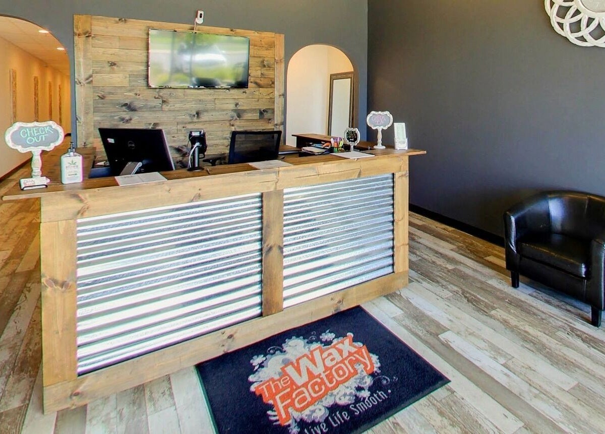Reception area of The Wax Factory Longmont in Longmont, Colorado, US, featuring a modern rustic design.