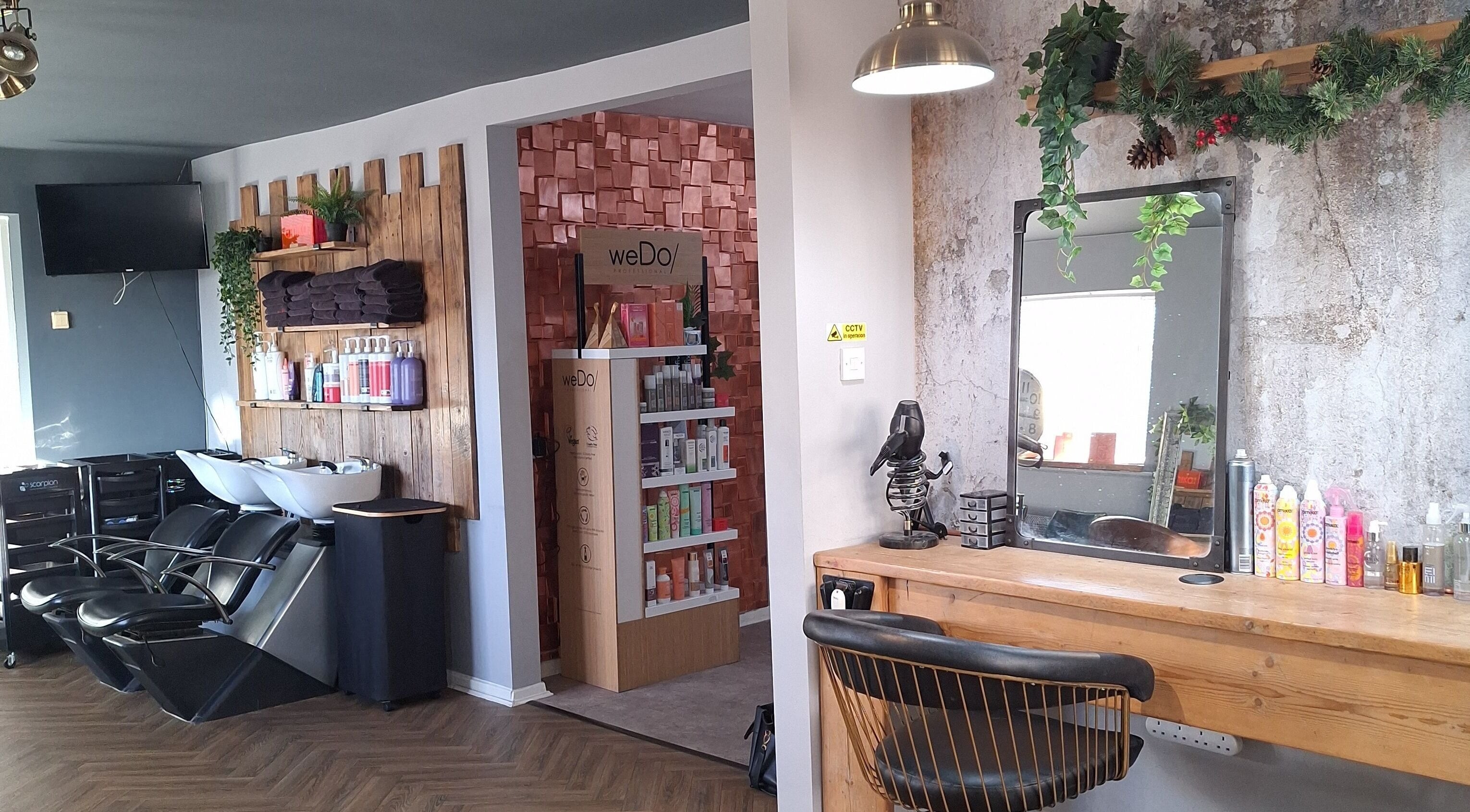 CHEVEUX salon in Beighton, England, GB features a rustic design with modern styling stations and product displays.