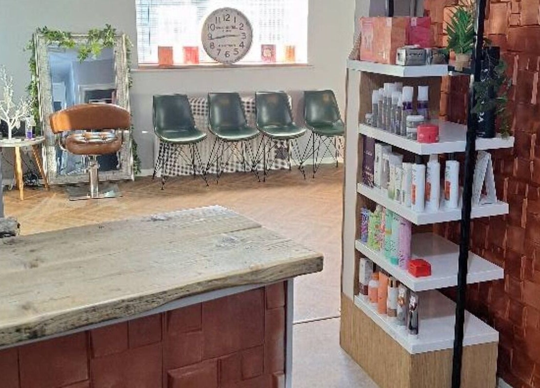 CHEVEUX salon interior in Beighton, England, GB showing a stylish seating area and modern product display.