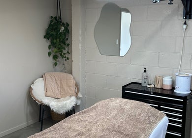 Cozy treatment room at Frankie & me, Kihikihi, Waikato, NZ. Plush chair, chic mirror, inviting and serene atmosphere.